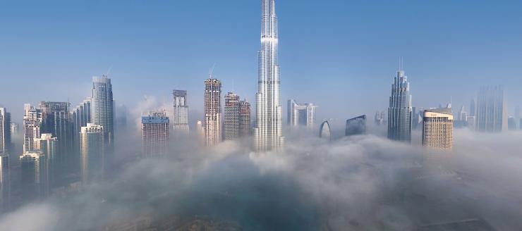 Aerial view of Burj Khalifa and other buildings surrounded by clouds Dubai, United Arab Emirates