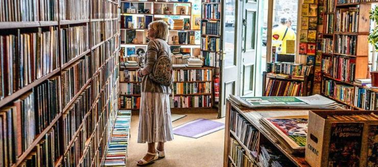 Woman in Bookshop browsing books